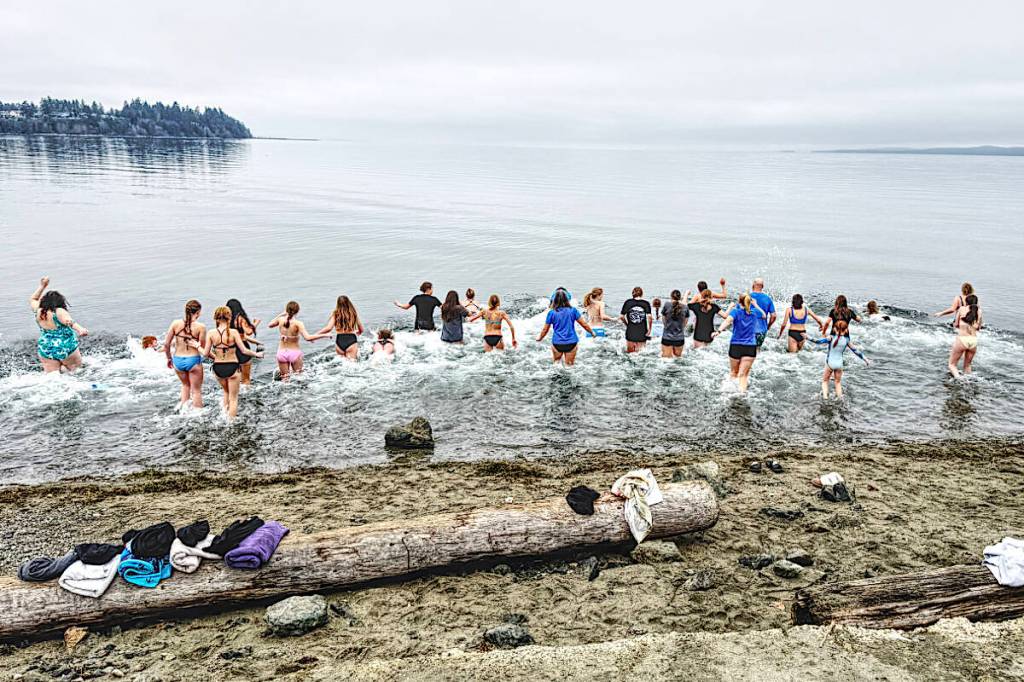 Athletes, coaches and families of the Oceanside Volleyball Club take a dip in the cold water in its first OVC Eagles Polar Bear Swim. (Contributed photo)